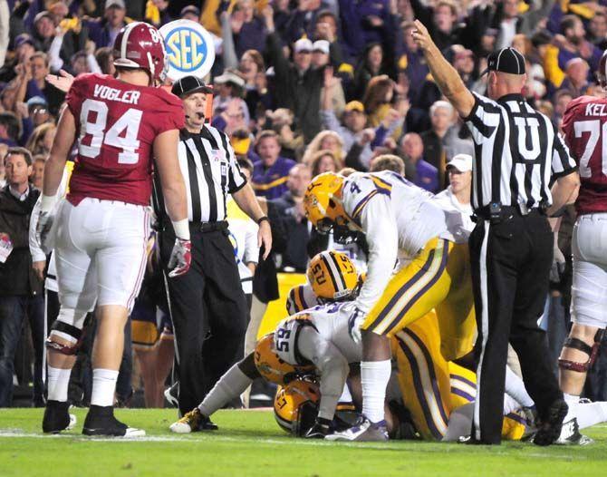 Members of the LSU defense pile on top of the football after an Alabama fumble Saturday, Nov. 8, 2014 during the Tigers' 20-13 loss against Alabama in Tiger Stadium.