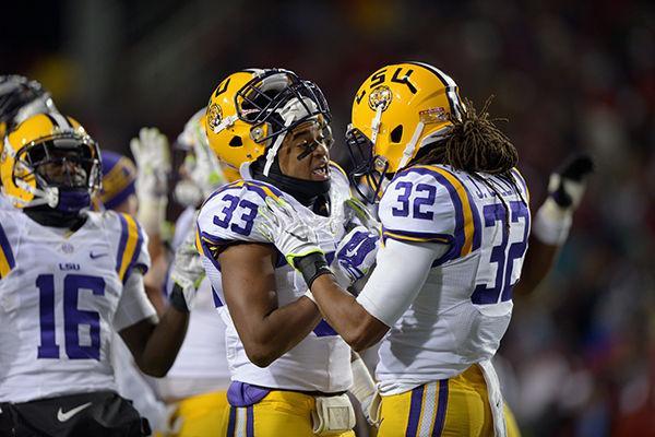 LSU freshman starter Jamal Adams (33) talks to teammate junior cornerback Jalen Collins (32) during a break in game against Arkansas Saturday, Nov. 15, 2014 in Donald W. Reynolds Razorback Stadium.