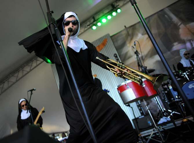 K.C. O'Rorke, vocalist and trumpeter for Flow Tribe, sings during their set on the Flambeau Stage on Friday, Nov. 1, 2013 at the 2013 Voodoo Music + Arts Experience.