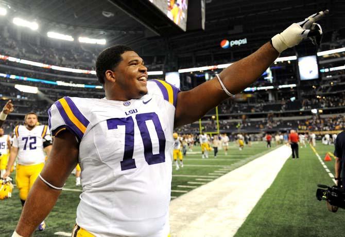 LSU junior offensive tackle La'El Collins (70) enthusiastically interacts with fans after the Tigers' 37-27 victory against TCU Saturday, August 31, 2013 in the 2013 Cowboys Classic at AT&amp;T Stadium in Arlington, Texas.