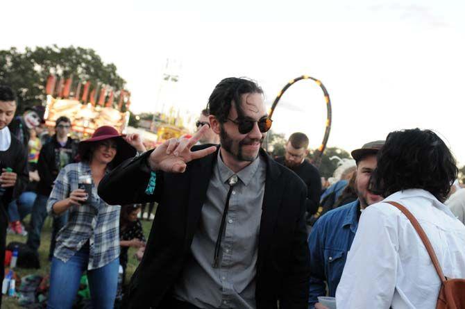 A festival goer dances on the festival grounds at VooDoo Music Experience Friday, October 31, 2014.