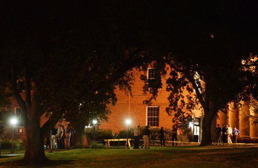 Authorities stand on the scene at Centenary College, Thursday, Nov. 20, 2014 in Shreveport, La. Shreveport Police are investigating a shooting that has left at least one person dead. (AP Photo/The Times, Henrietta Wildsmith)