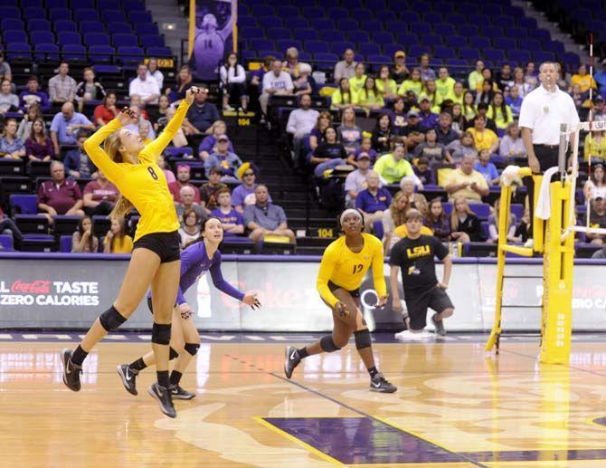 LSU senior outside hitter Helen Boyle (8) jumps to spike the ball during Tigers' 3-2 victory against Arkansas Sunday, October 5, 2014 in the PMAC.