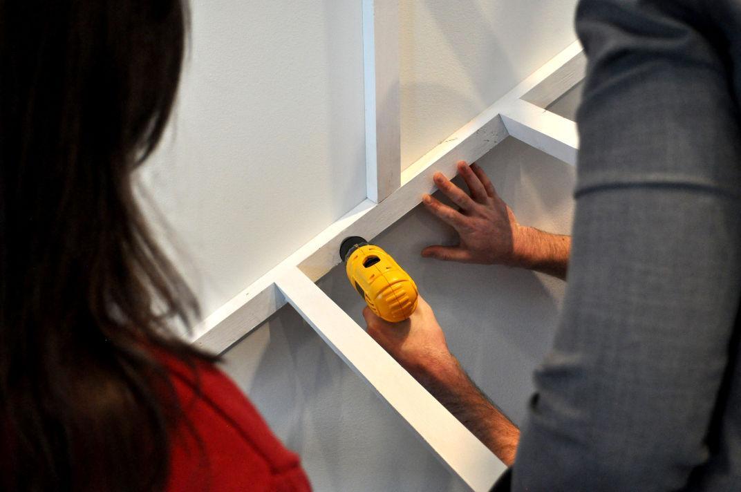 Local artist Silas Breaux works on his new installation, Dwelling, at the LSU Museum of Art on Wednesday.