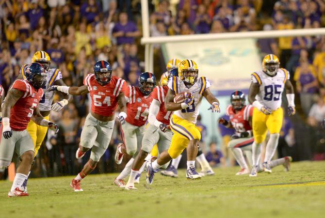 LSU senior runningback Terrance Magee (18) runs the ball In Tiger Stadium Saturday, October 25, 2014 where Tigers won 10-7 against Ole Miss.