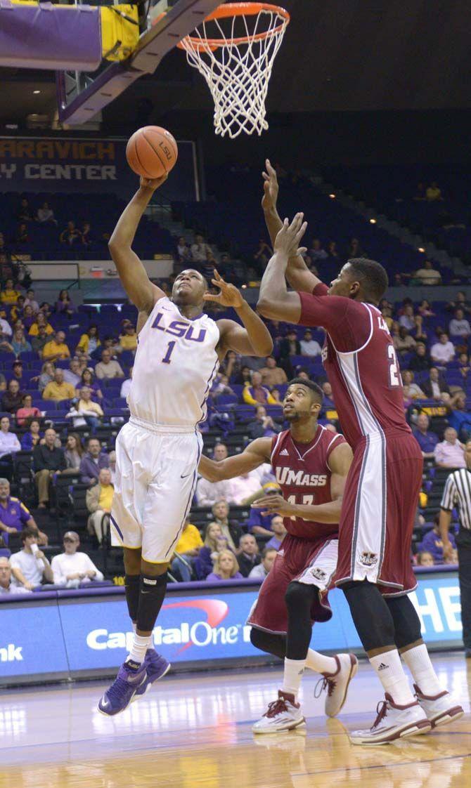 LSU junior forward Jarell Martin (1) makes a lay up during the Tigers' 82- 60 victory against Massachusetts Tuesday, Dec. 2, 2014 on the PEMAC.