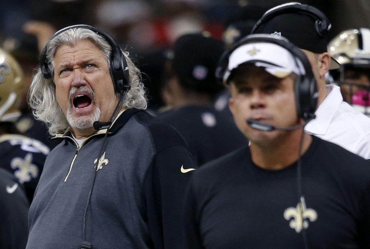 New Orleans Saints defensive coordinator Rob Ryan, left, yells behind head coach Sean Payton, right, in the second half of an NFL football game in New Orleans, Sunday, Dec. 21, 2014. (AP Photo/Bill Haber)