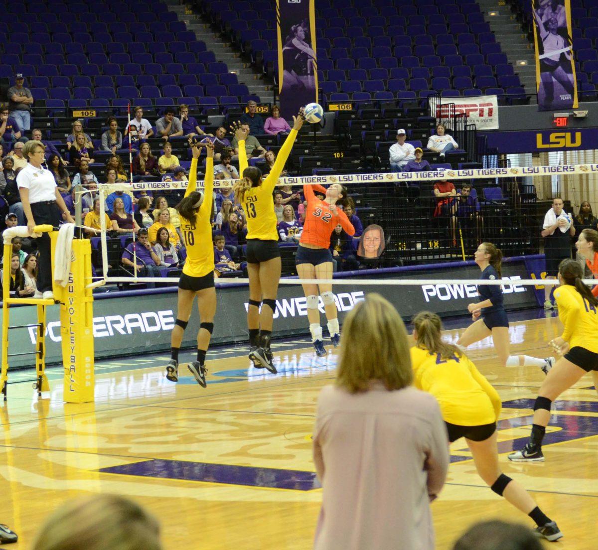 LSU freshman Mini Eugene (#10) and Sophomore Briana Holman (#13) blocks the ball at the 3-0 Win LSU vs Auburn at the PMAC November 23, 2014.