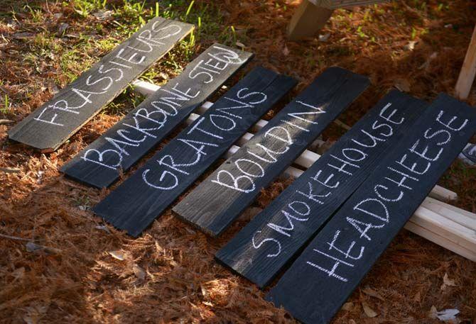 Members of Lache Pas make signs to identify different food stations Sunday, November 30, 2014 at La Boucherie Merci in Vermillionville, La.