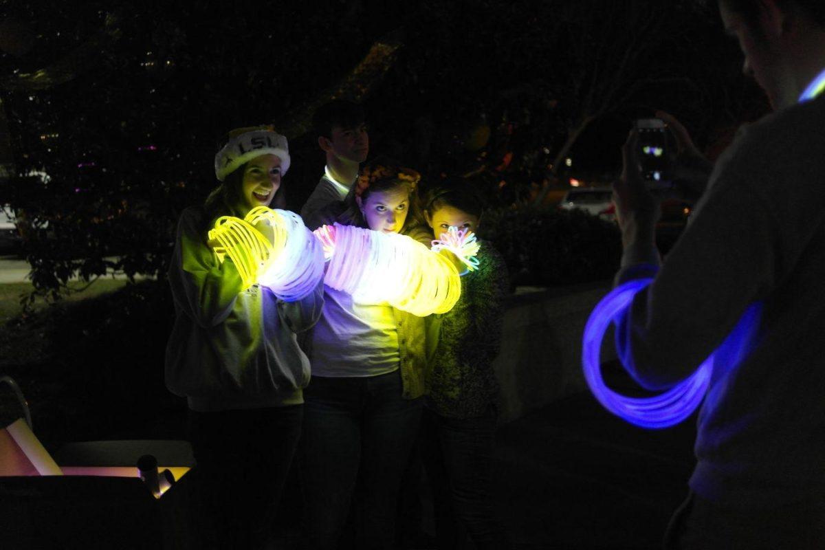 Students pose for a cell phone picture prior to the tree lighting on the LSU campus Tuesday night.&#160;