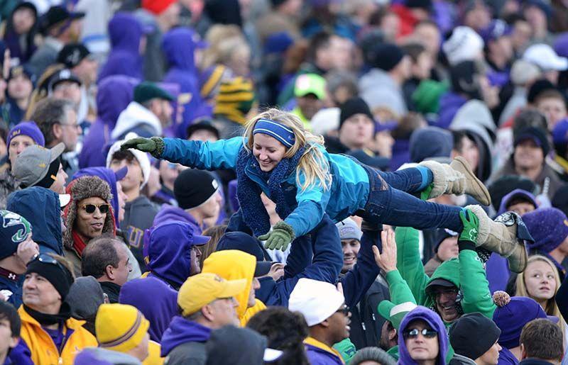 A fan gets lifted in the crowd during the Music City Bowl Tuesday, Dec. 30, 2014 at LP Field in Nashville. Notre Dame won against LSU 31-28 in the last quarter.