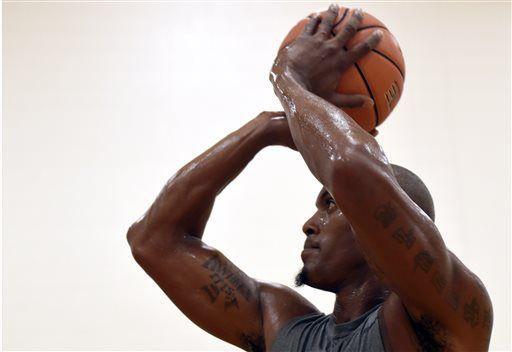 FILE - In this Oct. 15, 2014, file photo, former Minnesota Timberwolves forward Dante Cunningham works out at Penn State in State College, Pa. The New Orleans Pelicans have signed Cunningham, who has struggled to clear his name after domestic assault charges against him were dropped this summer. (AP Photo/John Beale, File)