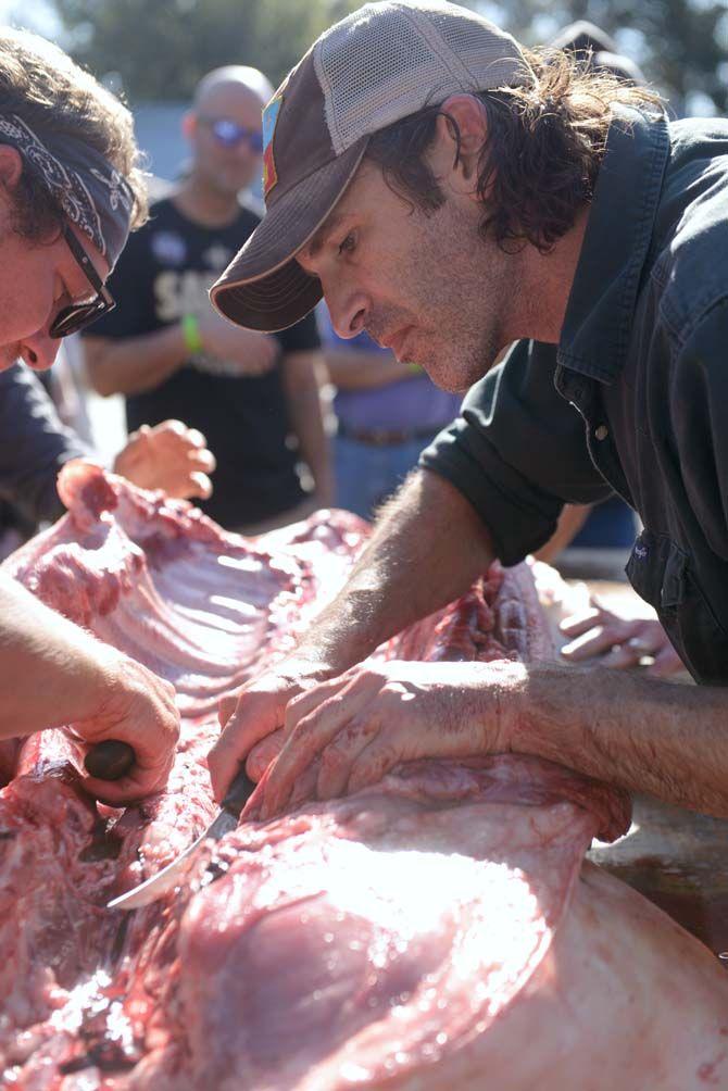 Toby Rodriguez and members of Lache Pas butcher a pig Sunday, November 30, 2014 at La Boucherie Merci in Vermillionville, La.