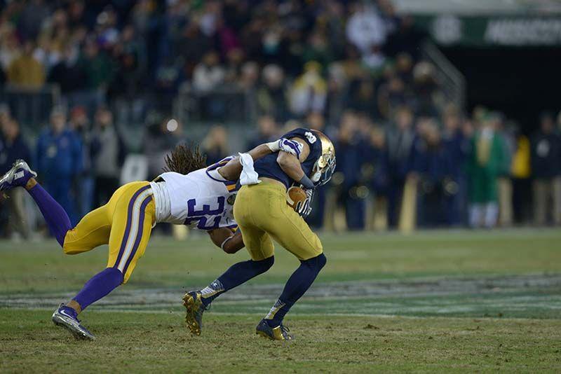 LSU junior corner back Jalen Collins (32) tackles Notre Dame player in bowl game Tuesday, Dec. 30, 2014 at LP Field in Nashville.