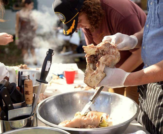 Cartilage and fat are removed from a pig's head to make head cheese Sunday, November 30, 2014 at La Boucherie Merci in Vermillionville, La.