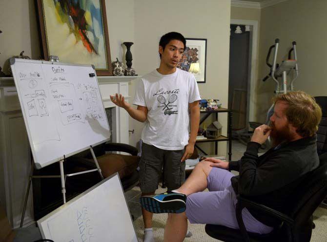 Sparehanger lead web developer Bee Vo explains a new concept for the website to CEO Peter Hubbs.