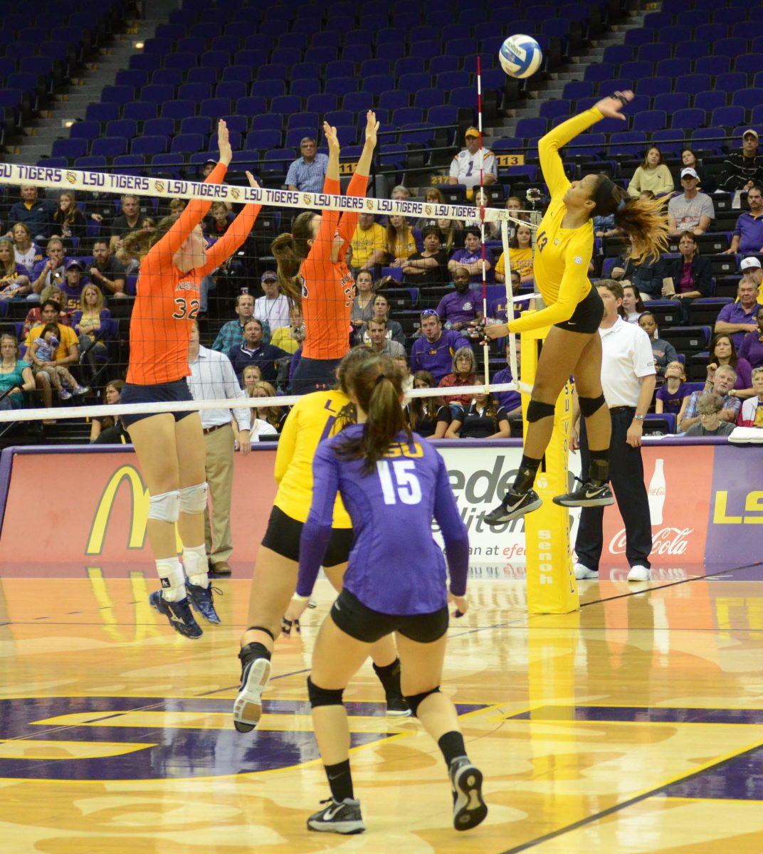 LSU sophomore Briana Holman (#13) spikes the ball against Auburn on Sunday November 23, 2014.