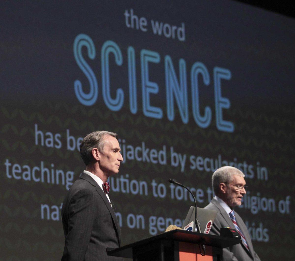 Creation Museum head Ken Ham, right, speaks during a debate on evolution with TV's "Science Guy" Bill Nye, at the Creation Museum Tuesday, Feb. 4, 2014, in Petersburg, Ky. Ham believes the Earth was created 6,000 years ago by God and is told strictly through the Bible. Nye says he is worried the U.S. will not move forward if creationism is taught to children. (AP Photo/The Courier-Journal, Matt Stone) NO SALES; MAGS OUT; NO ARCHIVE; MANDATORY CREDIT