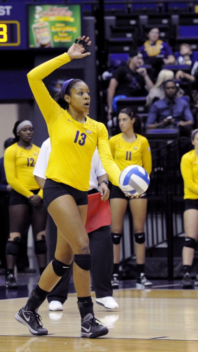 LSU sophomore middle blocker Briana Holman (13) gets ready to serve during the Tigers' 3-1 victory over Missouri Friday, Nov. 21, 2014 on the PMAC.