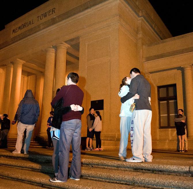 LSU business management junior Brian Wingerter and nutritional science sophomore Lauren Burns (right) kiss Thursday, Feb. 14, 2013 at midnight infront of the Memorial Tower for Valentine's Day.