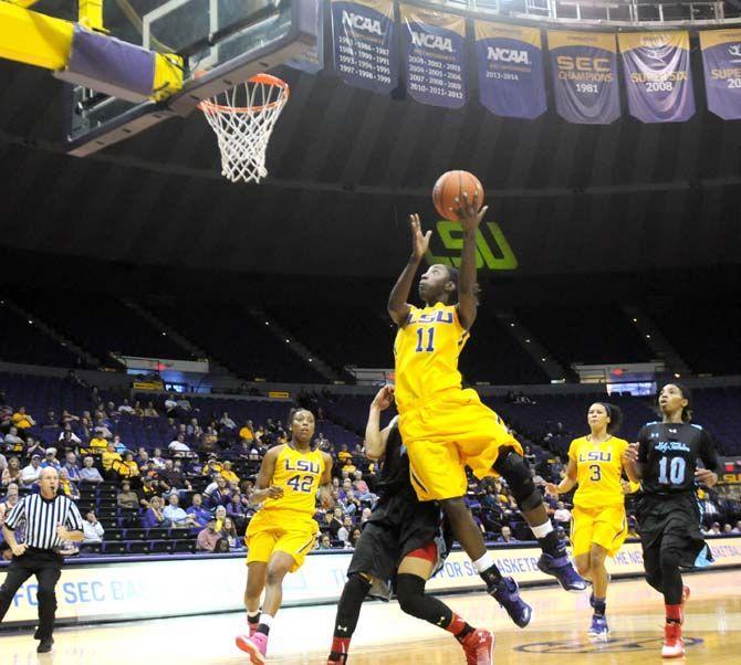 LSU sophomore guard Raigyne Moncrief (11) goes for a basket Wednesday, Dec. 3, 2014 during the Tigers' matchup against Louisiana Tech in the PMAC.