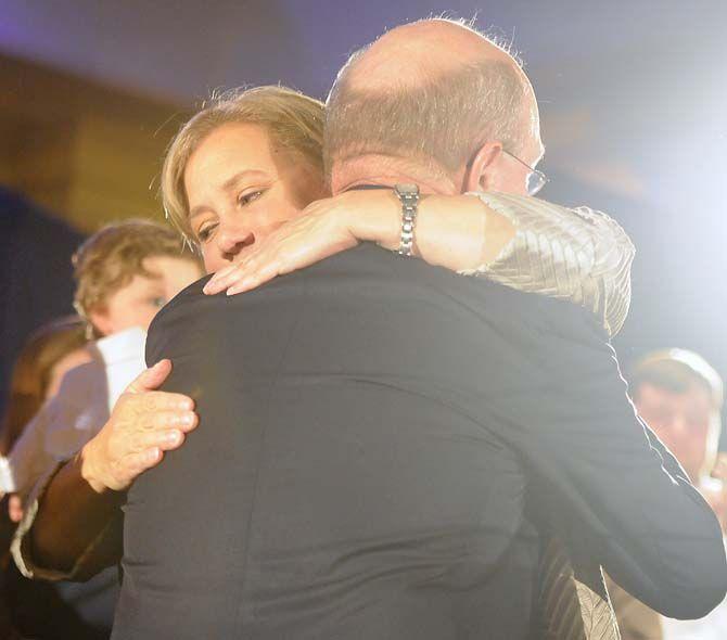 Sen. Mary Landrieu, D-La., hugs her husband after giving a concession speech Saturday, December 6, 2014 in the Waldorf Astoria Ballroom of The Roosevelt New Orleans.