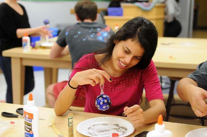 LSU mass communication and french language senior Ana Arjueta decorates an ornament in the Leisure Arts studio in the Union Friday, Dec. 5, 2014 for "Deck the Union Halls."