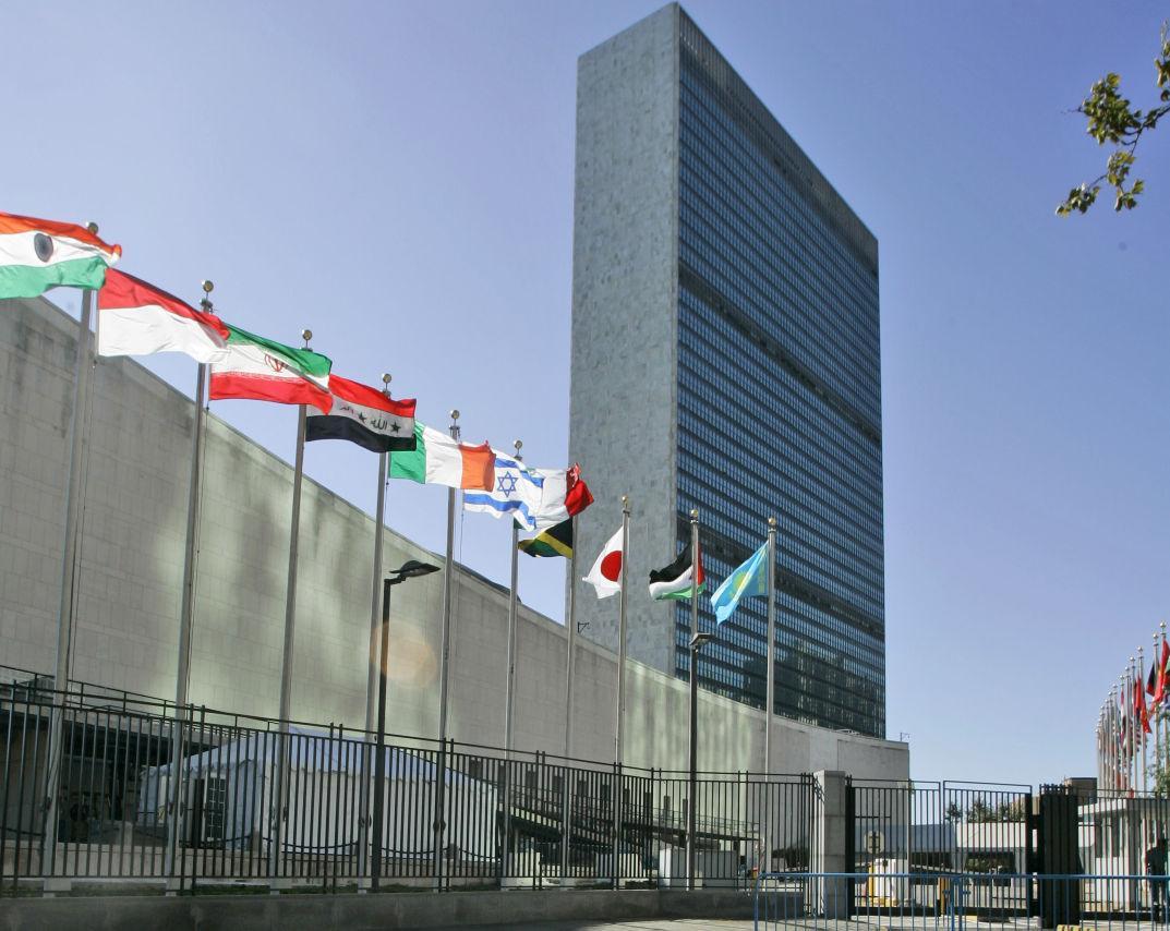 FILE - In this Sept. 18, 2007 file photo, the flags of member nations fly outside of the United Nations headquarters in New York. (AP Photo/Mary Altaffer, File)