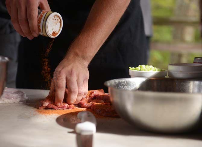 Tasso is seasoned before being smoked Sunday, November 30, 2014 at La Boucherie Merci in Vermillionville, La.