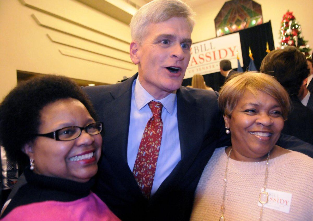 US senator elect Bill Cassidy celebrates win against Mary Landrieu with supporter Janice Montague-Myles and Sarah Holiday at the Crowne Plaza Hotel Saturday December 6, 2014.