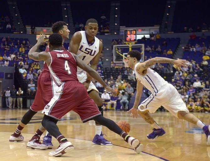 LSU sophomore forward Jarell Martin (1) does a screen to relieve junior Josh Gray (5) during the Tigers' 82- 60 victory against Massachusetts Tuesday, Dec. 2, 2014 on the PEMAC.