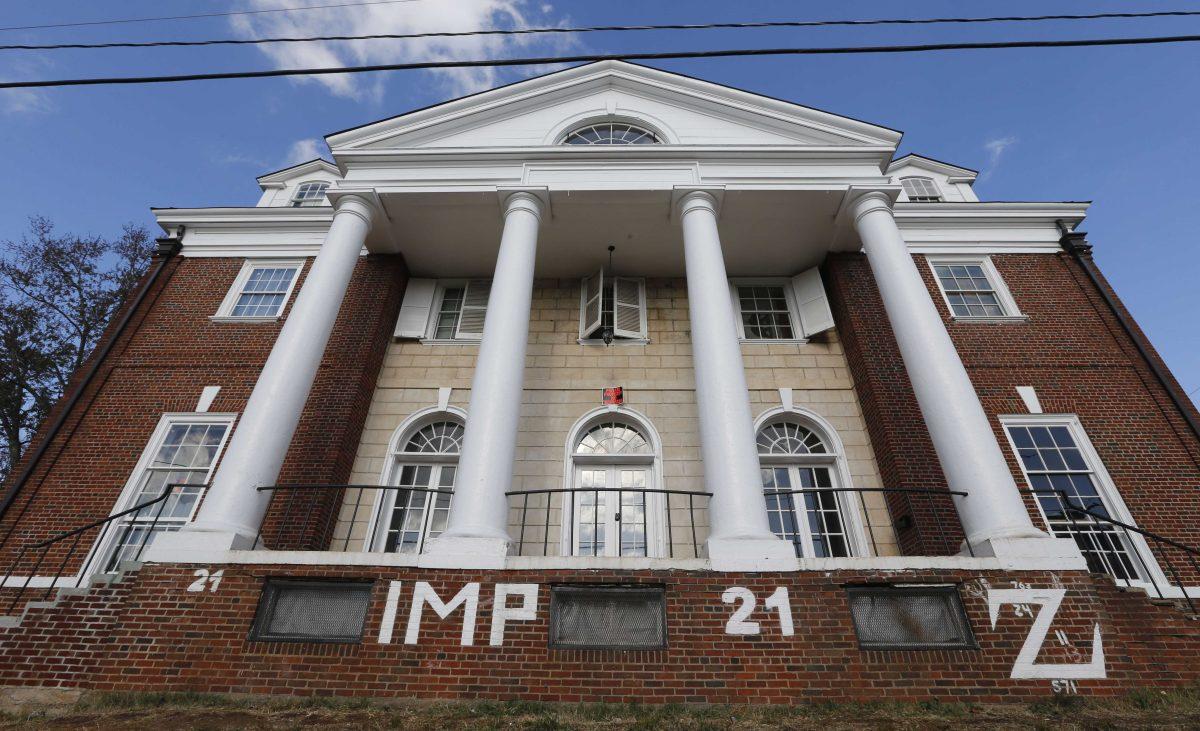 FILE - This Nov. 24, 2014, file photo, shows the Phi Kappa Psi house at the University of Virginia in Charlottesville, Va. Greek organizations at the school have until Friday, Jan. 16, 2015, to agree to new drinking rules as a condition for ending a temporary ban on social activities, which UVa. President Teresa A. Sullivan imposed following a November Rolling Stone article describing a campus culture that fosters violence against women. The article was later discredited by the magazine's editors. (AP Photo/Steve Helber, File)