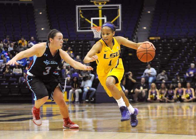 LSU freshman guard Jenna Deemer (1) dribbles the ball past Louisiana Tech sophomore guard Ruby Richie (3) on Wednesday, Dec. 3, 2014, during the Tigers' 73-59 win against the Lady Techsters in the Pete Maravich Assembly Center.