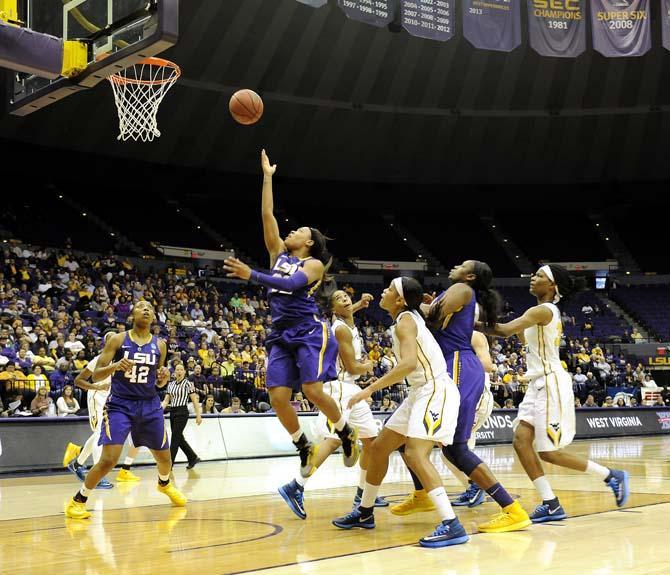 LSU sophomore guard Danielle Ballard (32) attempts a shot Tuesday, March 25, 2014 during the Lady Tigers' 76-67 victory against West Virginia in the PMAC.