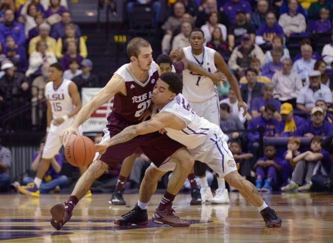 LSU junior guard Josh Gray (5) steals the ball during Tigers' 67-64 defeat against Texas A&amp;M on Sturday, Jan. 17, 2015 in the Pete Maravich Assembly Center.