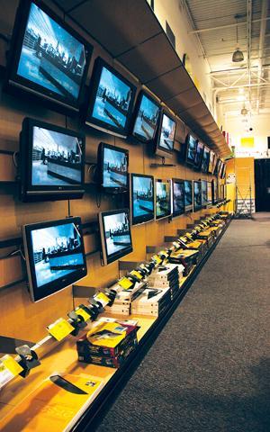 A wide array of Hi-Definition televisions for sale hang on display at Best Buy on Bluebonnet Boulevard on March 9. Many factors are to be considered before deciding on the right screen.