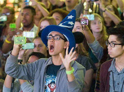 FILE - In this Aug. 2013 file photo, fans attend an event at Disneyland in Anaheim, Calif. Seven Californians and two people in Utah have confirmed cases of measles likely contracted on trips last month to Disney theme parks in California, state officials said Wednesday, Jan. 7, 2015. (AP Photo/The Orange County Register, Mindy Schauer)