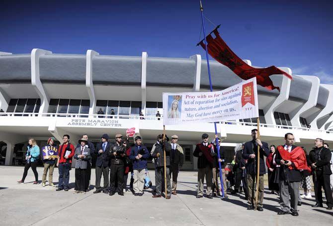 Protesters stand outside the Pete Maravich Assembly Center Saturday, Jan. 24, 2015, after a pro-life march held in support of "The Response."