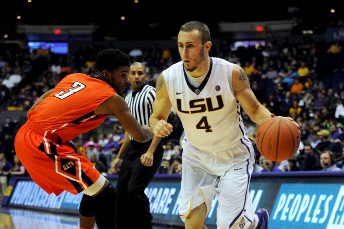 LSU junior guard Keith Hornsby (4) dribbles the ball past Sam Houston State sophomore guard Dakarai Henderson (3) Saturday, Dec. 13, 2014 during the Tigers' 76-67 win against the Bearkats in the PMAC.