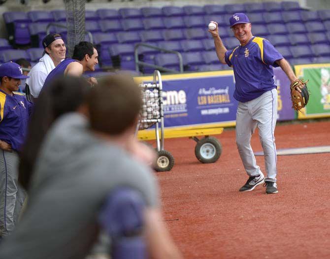 LSU baseball head coach Paul Mainieri plays catch Monday, October 6, 2014 during baseball practice in Alex Box Stadium.