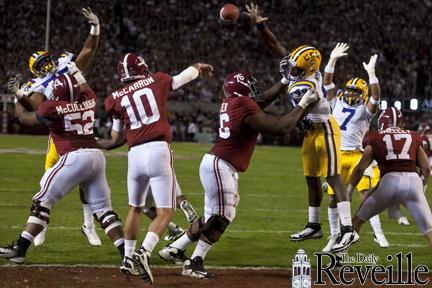 LSU defensive end Barkevious Mingo (49) reaches to block a pass by Alabama quarterback AJ McCarron on Nov. 5, 2011.