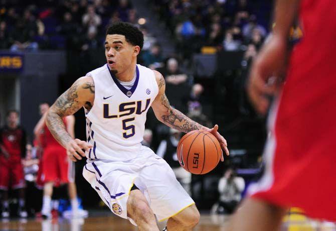 LSU junior guard Josh Gray (5) looks to his teammates as he dribbles the ball down the court on Saturday, Jan. 10, 2015, during the Tigers' 87-84 win against Georgia in the Pete Maravich Assembly Center.