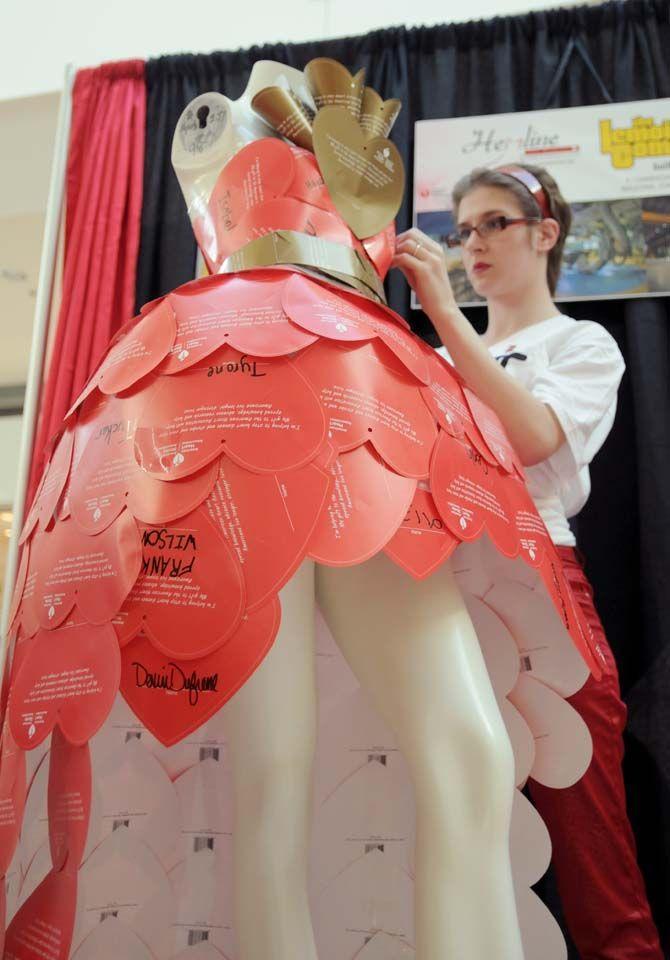 LSU fashion merchandising student and first place winner Rebecca Stephens works on her dress during Hemline's dress building compettion in order to raise awareness and educate the public on heart disease on Saturday, Jan. 24, 2015 at the Mall of Louisiana.