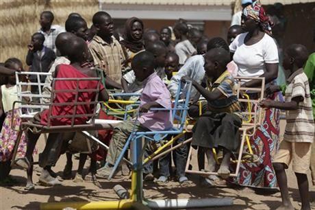 In this Thursday Nov. 27, 2014 photo, children displaced after attacks by Boko Haram, play in the camp of internal displaced people, in Yola, Nigeria. Seven children have been reunited with parents lost in the chaos of attacks in Nigeria's northeastern Islamic insurgency but hundreds more remain alone, officials say of youngsters who have no idea if their families are alive or dead. (AP Photo/Sunday Alamba)