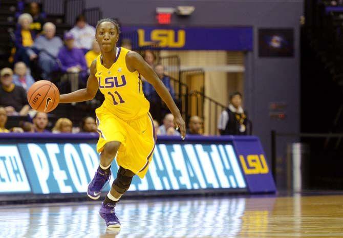 LSU sophomore guard Raigyne Moncrief (11) dribbles the ball down the court on Wednesday, Dec. 3, 2014, during the Tigers' 73-59 win against the Lady Techsters in the Pete Maravich Assembly Center.