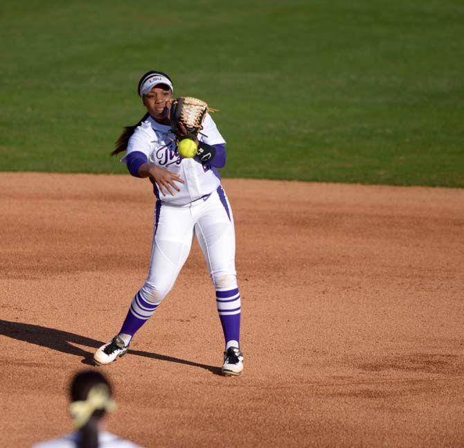 LSU junior infield Bianka Bell (27) throws the ball to first base on Saturday, Feb. 7, 2015 during the Tiger' 10-0 victory against Tennessee State in Tiger Park.