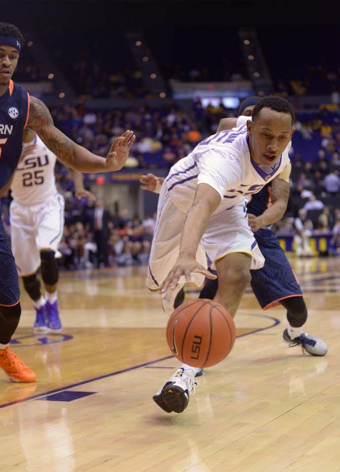 LSU sophomore guard Tim Quarterman (55) tires to control the ball during the Tigers' 81-77 defeat over Auburn on Thursday, Feb. 5, 2015 at the Pete Maravich Assembly Center.