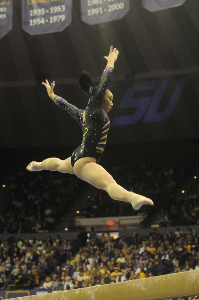 LSU freshman all around Erin Macadaeg performs her beam routine during the Tigers' 197.950-197.425 victory against Florida on Friday, Feb. 20, 2015 in the Pete Maravich Assembly Center