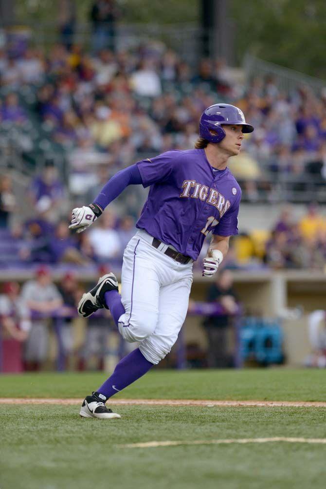 LSU senior outfielder Jared Foster (17) runs to first base during the Tigers' 16-2 victory against Boston College on Wednesday, Feb. 21, 2015 at Alex Box Stadium.