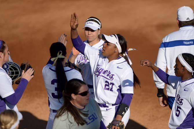 LSU junior infield Bianka Bell (27) celebrates with teammates after getting three outs on Saturday, Feb. 7, 2015 during the Tiger' 10-0 victory against Tennessee State in Tiger Park.